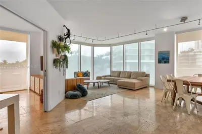 a living room with a couch and a table at High-Rise Haven by the Sea in Sunny Isles Beach