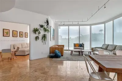 a living room with a couch and a table at High-Rise Haven by the Sea in Sunny Isles Beach