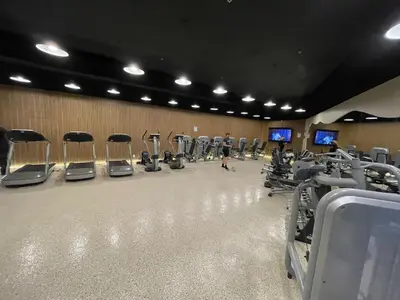a gym with a row of chairs and machines at Shine Suites Duplex Bay7A in Miami Beach