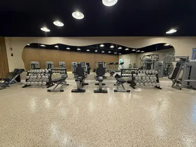 a gym with rows of chairs and treadmills at Shine Suites Duplex Bay7A in Miami Beach