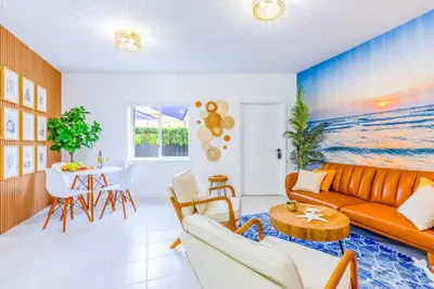 a living room with a couch and a table at Prime Miami Retreat | Sleeps 12 | Parking, BBQ! in Miami