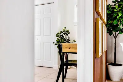 a room with a table and potted plants at Prime Miami Retreat | Sleeps 12 | Parking, BBQ! in Miami