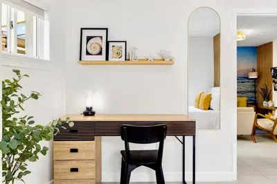 a desk in a room with a bedroom at Beachy Living |Sleep 8 Best Location | BBQ & Patio in Miami