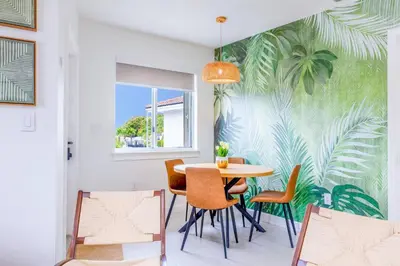 a dining room with a table and chairs at Tropical | 8PPL | Top Location | Parking | Laundry in Miami