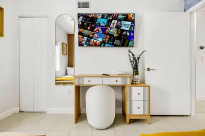 a desk and a chair in a room with a mirror at Tropical | 8PPL | Top Location | Parking | Laundry in Miami