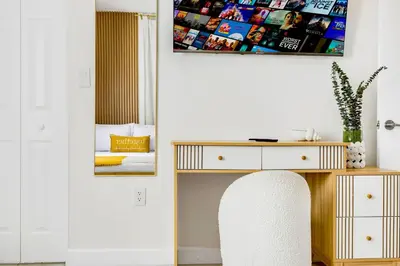 a white room with a desk and a white chair at Tropical | 8PPL | Top Location | Parking | Laundry in Miami
