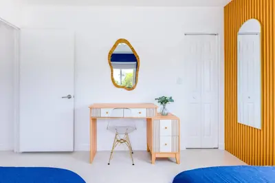 a desk in a bedroom with a mirror and a bed at Marina | Top Location | 8PPL | Parking | Laundry in Miami