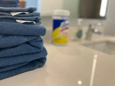 a stack of blue towels sitting on a counter at Downtown Miami Luxury Condo apartment in Miami