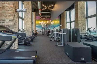 a gym with a bunch of treadms and machines at Downtown Miami Luxury Condo apartment in Miami