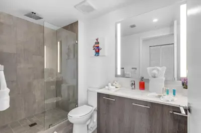 a bathroom with a toilet and a shower and a sink at 2 Bed Best Views in Downtown and Brickell in Miami