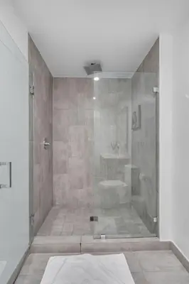 a bathroom with a shower with a glass door at 2 Bed Best Views in Downtown and Brickell in Miami