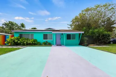 a house with a green and blue house at Charming Hideaway Near Beach, Nightlife & Shops in Fort Lauderdale