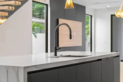 a kitchen with a sink and a counter at Jungle Serene Lux Home with Pool Sauna Ice Bath in Fort Lauderdale