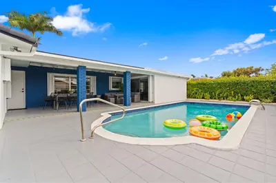 a swimming pool with inflatable balls in a house at Chicago Vibe Heated Pool 5BR 2BTH in Miami