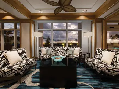 a living room with couches and a ceiling fan at Marriott's BeachPlace Towers Studio Apartment with Resort Access in Fort Lauderdale