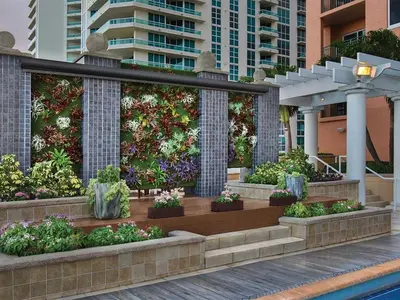 a garden with flowers and plants in a building at Marriott's BeachPlace Towers Studio Apartment with Resort Access in Fort Lauderdale