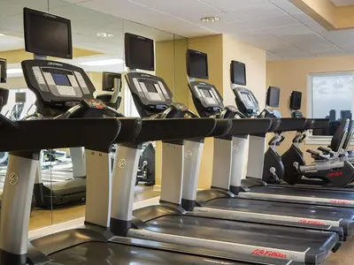 a row of tread machines in a gym at Marriott's BeachPlace Towers Studio Apartment with Resort Access in Fort Lauderdale