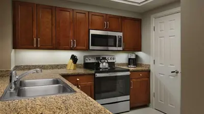a kitchen with a sink and a stove at Marriott's BeachPlace Towers 1BR Apartment with Resort Access in Fort Lauderdale