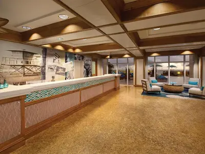 a lobby with a bar with chairs and tables at Marriott's BeachPlace Towers 1BR Apartment with Resort Access in Fort Lauderdale