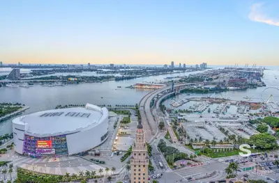 an aerial view of a large city with a river at Sleek 3-BD Downtown Miami Condo with Water & City Views in Miami