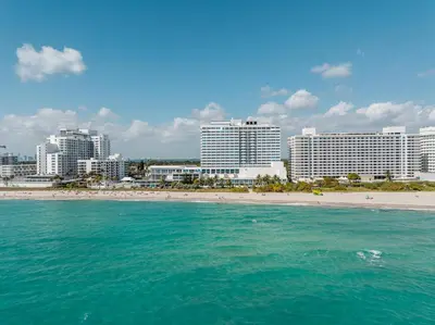 a view of a beach with hotels and buildings at Shine Suites Studio 8 in Miami Beach