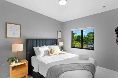 a bedroom with a large bed and a window at Family-Friendly Apt in Miami - Sleeps 4, Near Everything in Miami