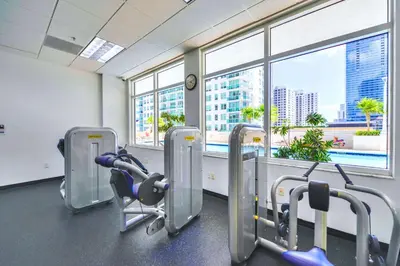 a gym with a view of a city at Brickell Condo w City View & Pool Access in Miami