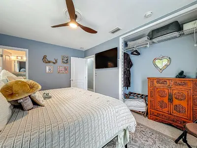a bedroom with a bed and a ceiling fan at Boho Oasis -World Cup base- under 20 min to stadium & FLL airport in Fort Lauderdale