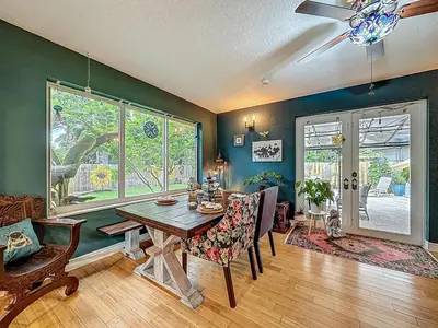 a dining room with a table and some chairs at Boho Oasis -World Cup base- under 20 min to stadium & FLL airport in Fort Lauderdale