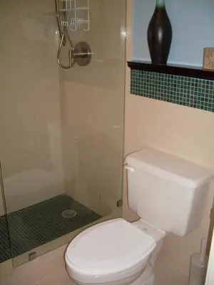 a bathroom with a toilet and a glass shower at 2 bedroom at The Roney Palace Condominiums Apt 1006 in Miami Beach