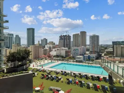 a view of a swimming pool on top of a building at Electric Luxury Downtown Bayfront Brickell in Miami