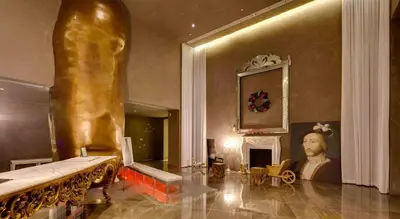 a living room with a statue and a fireplace at Sublime Ocean & Pool View Unit At Icon Brickell in Miami