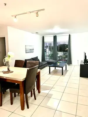 a living room with a table and a couch at 202 Private bedroom in Miami - Coral Gables in Miami