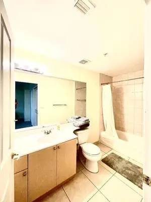 a bathroom with a toilet and a sink and a tub at 202 Private bedroom in Miami - Coral Gables in Miami