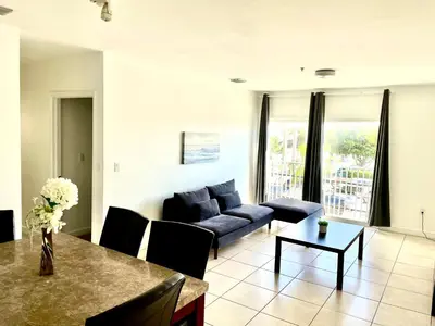 a living room with a couch and a table at 202 Private bedroom in Miami - Coral Gables in Miami