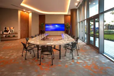 a conference room with a large table and chairs at Charming Condo for Your Dream Vacation in Hollywood