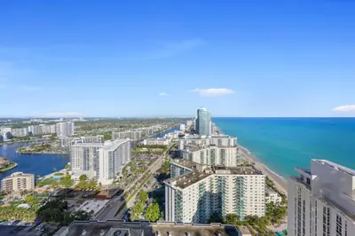 an aerial view of a city and the ocean at Luxury 2BR Beachfront Rooftop Pool and Spa in Hollywood