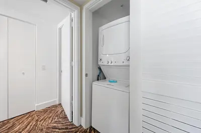 a white laundry room with a washer and dryer at Luxury 2BR Beachfront Rooftop Pool and Spa in Hollywood