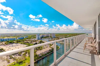 a balcony with a view of a city at Modern Condo Retreat with Ample Space in Hollywood