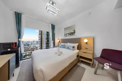 a bedroom with a large bed and a window at Stylish City Condo in the Heart of Downtown Miami in Miami