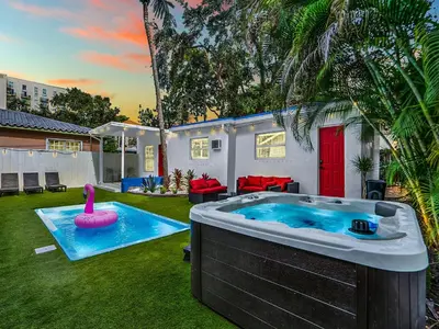 a swimming pool with a pink flamingo in a backyard at Bungalow House 6 BR Pool Little Havana in Miami