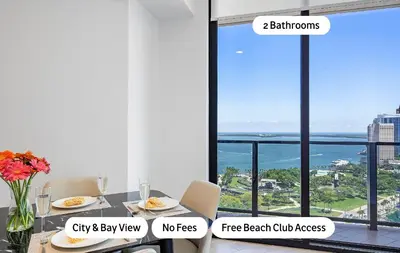 a dining room with a table with a view of the ocean at MVR Stunning Views Superhost Service in Miami