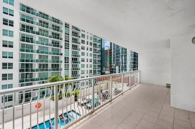 an apartment balcony with a view of a building at Enjoy Pool and Stunning City Views in Brickell in Miami