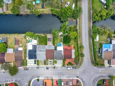 an overhead view of a city with houses and a street at Canal Views from Pool w BBQ and Pit Miami Escape in Kendale Lakes