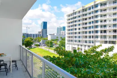 a balcony with a view of a city at Contemporary Condo in Wynwood w Free Parking in Miami