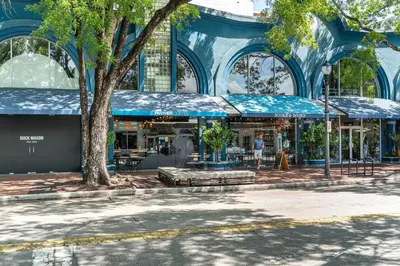 a man standing in front of a building at Stylish Studio King Bed City View Hotel Perks Parking in Miami