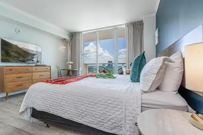 a bedroom with a large bed and a large window at Modern 3BR 3BA Grove Condo Views Balconies Full Kitchen 3 Parking in Miami