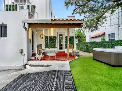 a white house with a gazebo at Casa Verde Design District 5BR Hot Tub in Miami