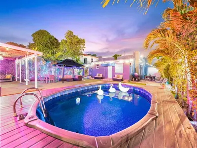 a house with a swimming pool and a deck at Villa Ciao Bella Sleeps 25 Pool Hot Tub in Miami