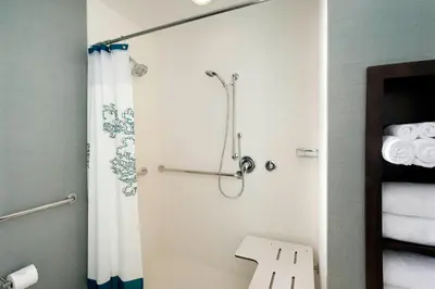 a bathroom with a shower with a shower curtain at Residence Inn by Marriott Miami Airport West/Doral in Miami